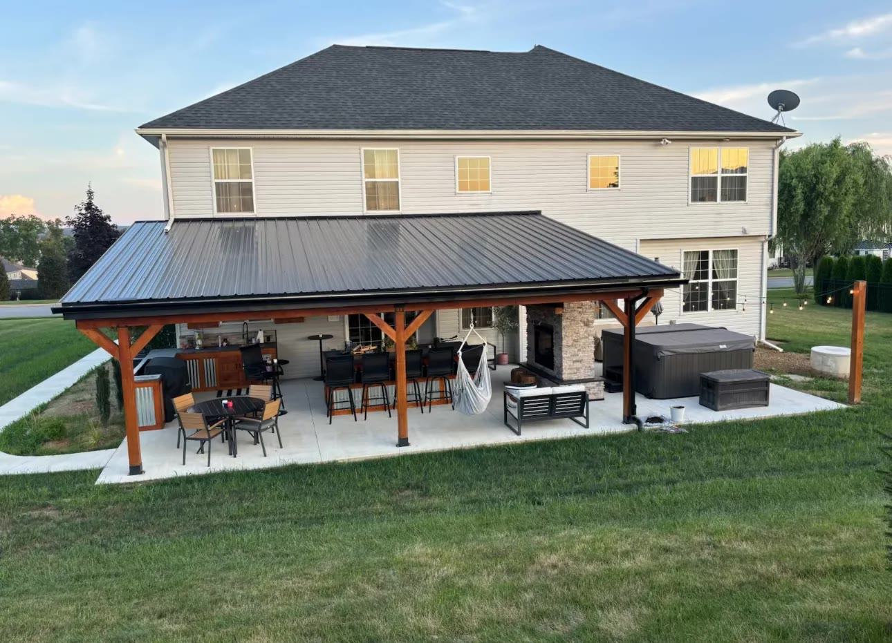 Wide finished ASRE covered patio and outdoor living space behind a home