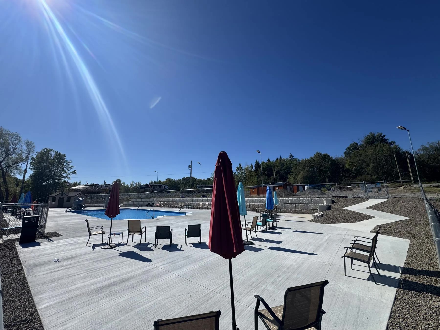 Finished commercial campground pool deck and seating area built by ASRE
